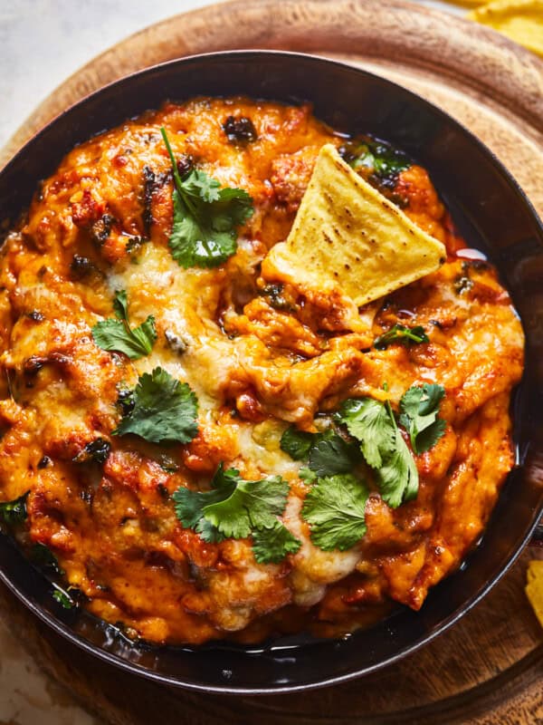 mexican cheese dip in a skillet with tortilla chips.