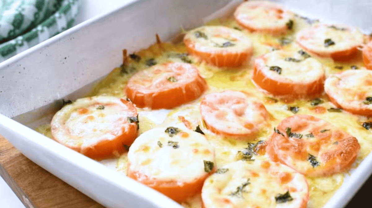 baked tomatoes with cheese in a baking pan.