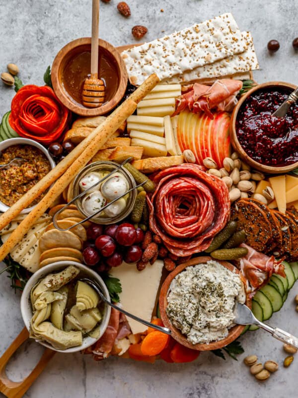 A platter with a variety of meats and cheeses.