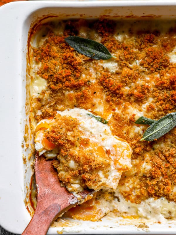 A casserole dish with a wooden spoon in it.