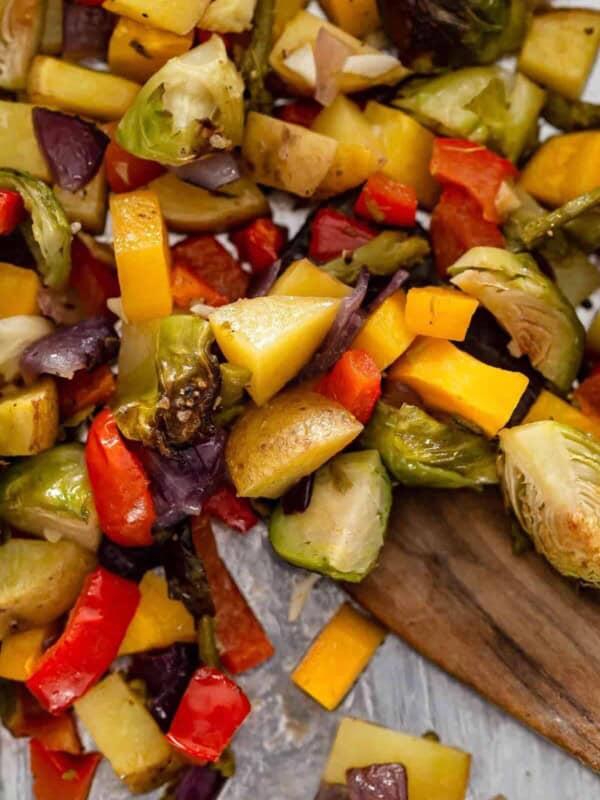 close up view of chopped roasted vegetables on a pan