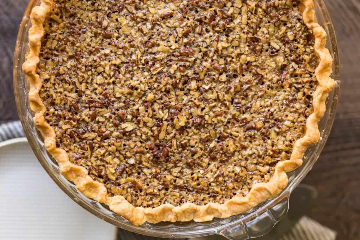 Classic Pecan Pie in a glass dish.