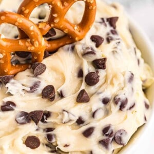 up close image of chocolate chip cookie dough dip with pretzels