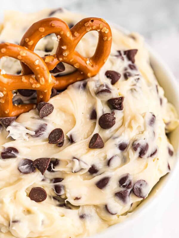 up close image of chocolate chip cookie dough dip with pretzels