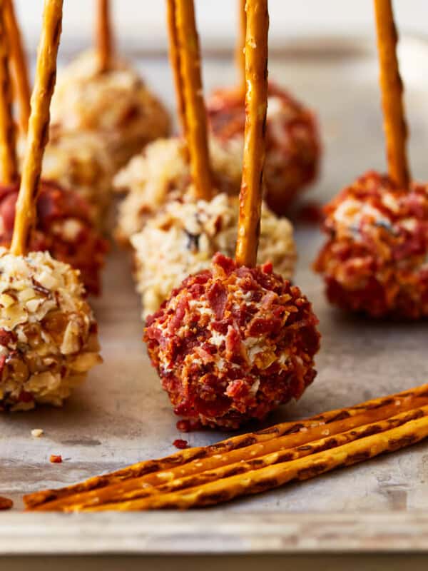 mini cheese ball bites with pretzel sticks.