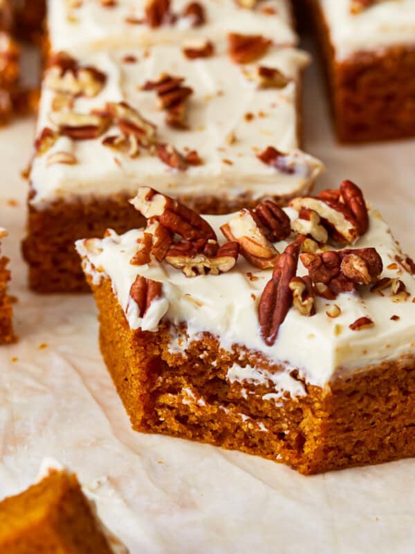 Pumpkin bars with cream cheese frosting and pecans.