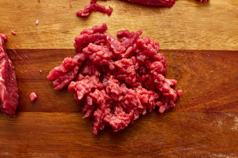 Raw beef on a cutting board.