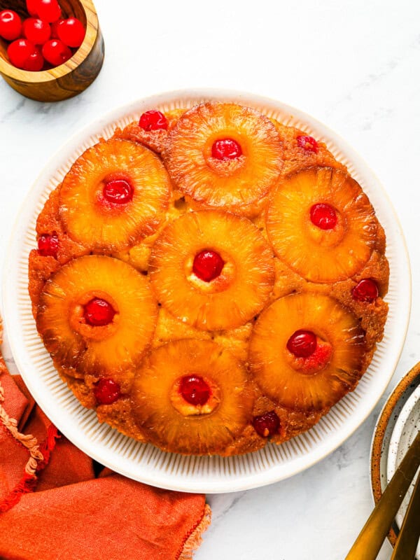 A pineapple upside down cake on a plate.