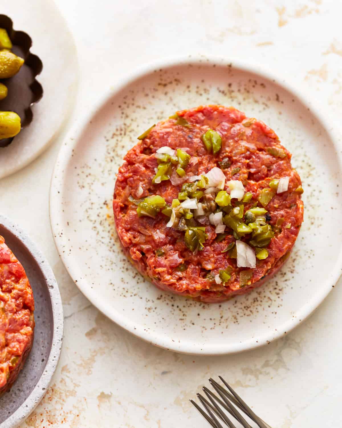 steak tartare on a white plate.