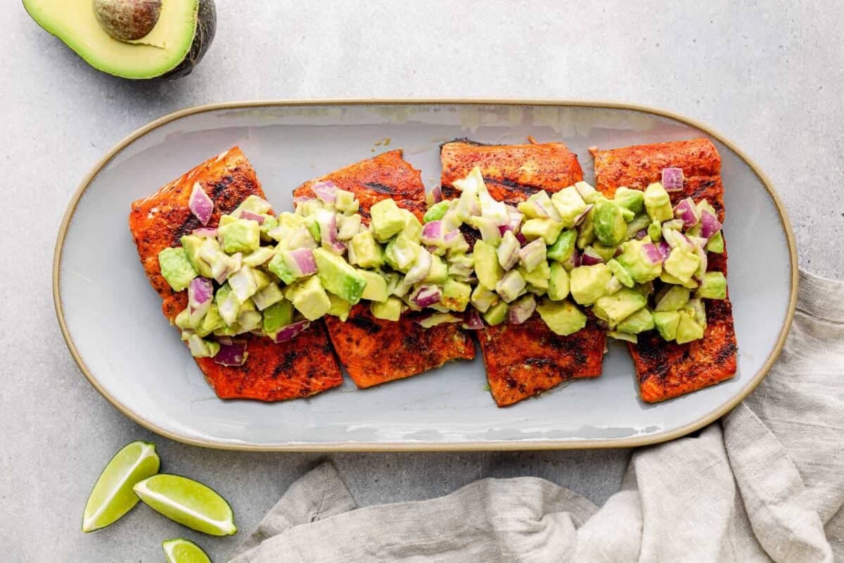 platter of grilled salmon with avocado salsa