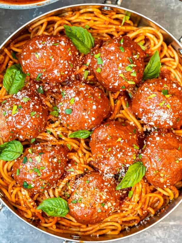 meatballs over pasta in pan