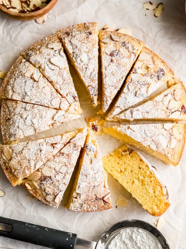 A moist almond cake topped with a delicate dusting of powdered sugar.