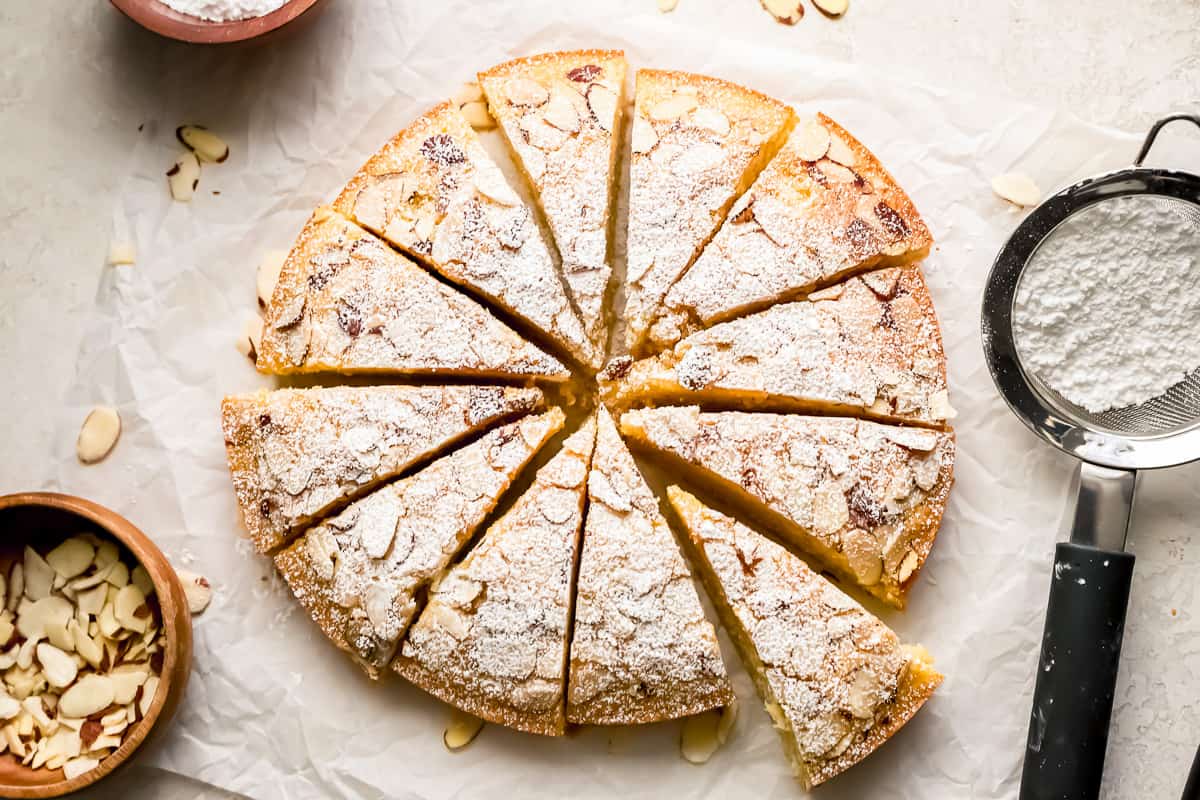 An almond cake with almonds on top.