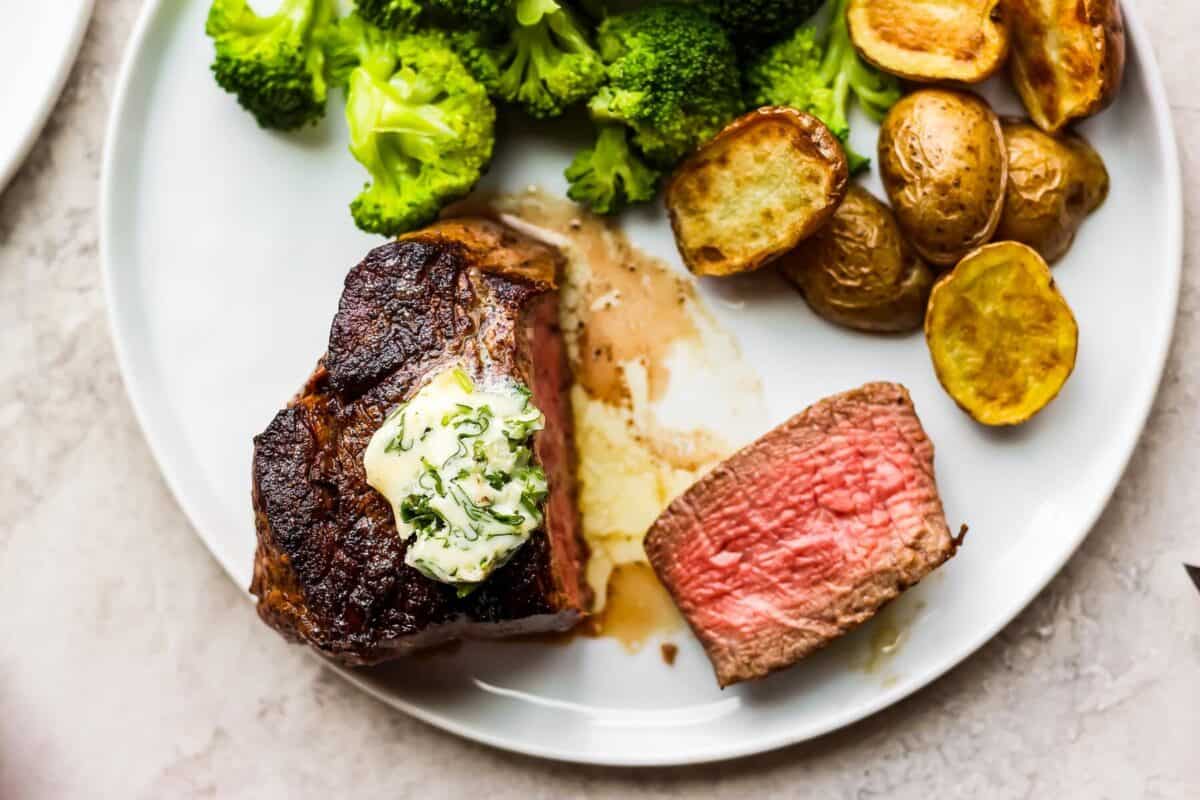 A steak recipe featuring potatoes and broccoli.