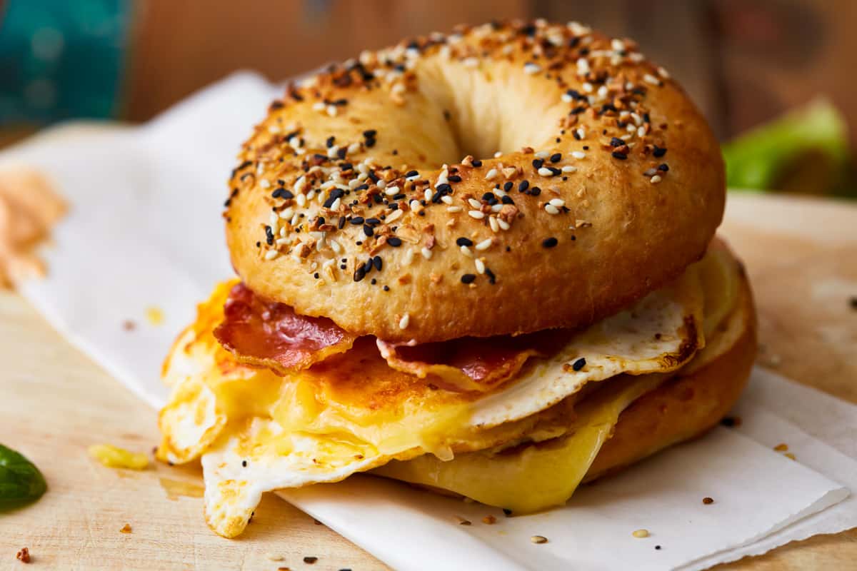 A bacon, egg, and cheese bagel sandwich.