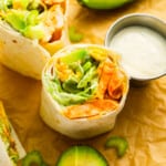 Chicken burritos with avocado, salsa, and buffalo chicken wrap.