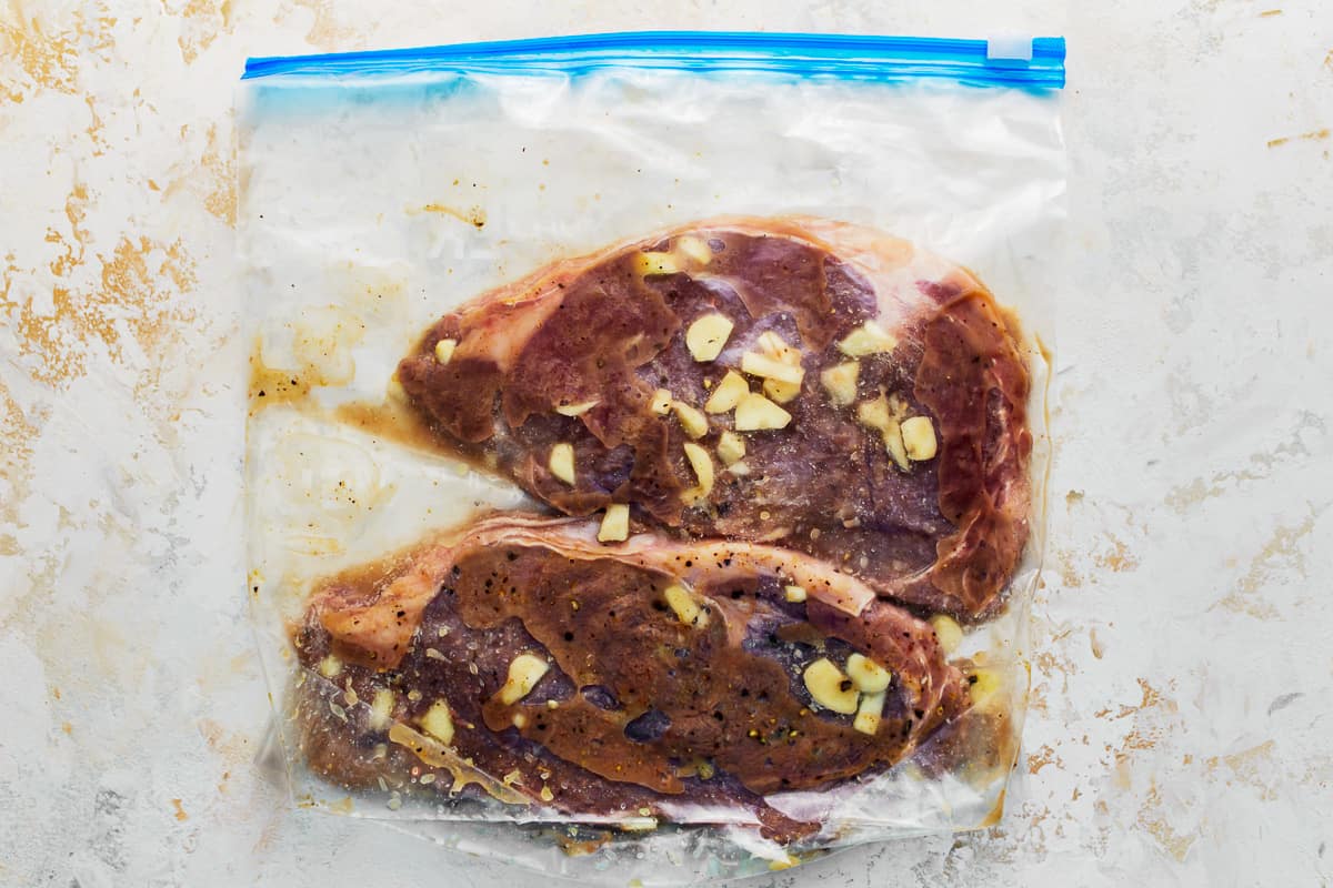 Steak in a Ziplock bag with marinade.