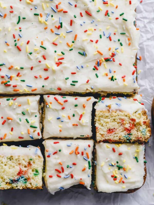 close up view of partially cut funfetti cake.