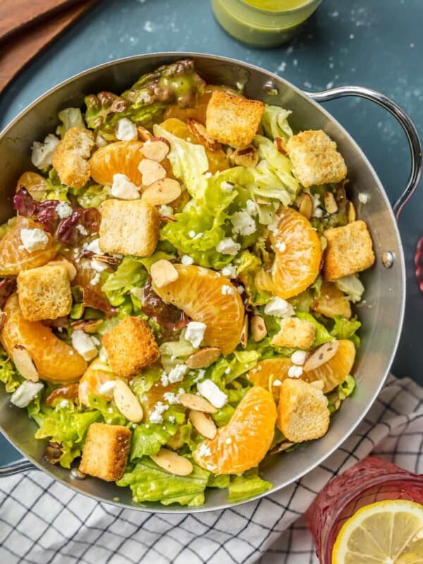 This MANDARIN ORANGE SALAD with ALMONDS AND CIDER VINAIGRETTE has been a favorite in our family forever! SO flavorful and easy. Such a great salad to throw together anytime!