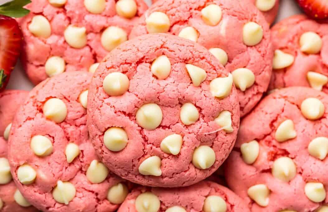 Strawberry Cookies are my favorite Strawberry Cake Mix Cookies! These White Chocolate Strawberry Cake Mix Cookies are so fun and delicious, and so super easy! Fun, festive, and SUPER SIMPLE! Strawberry Cookies with White Chocolate Chips are the perfect Pink Cookies for Valentine's Day, Easter, baby and wedding showers, and beyond! This Cake Mix Cookies Recipe will blow your mind.