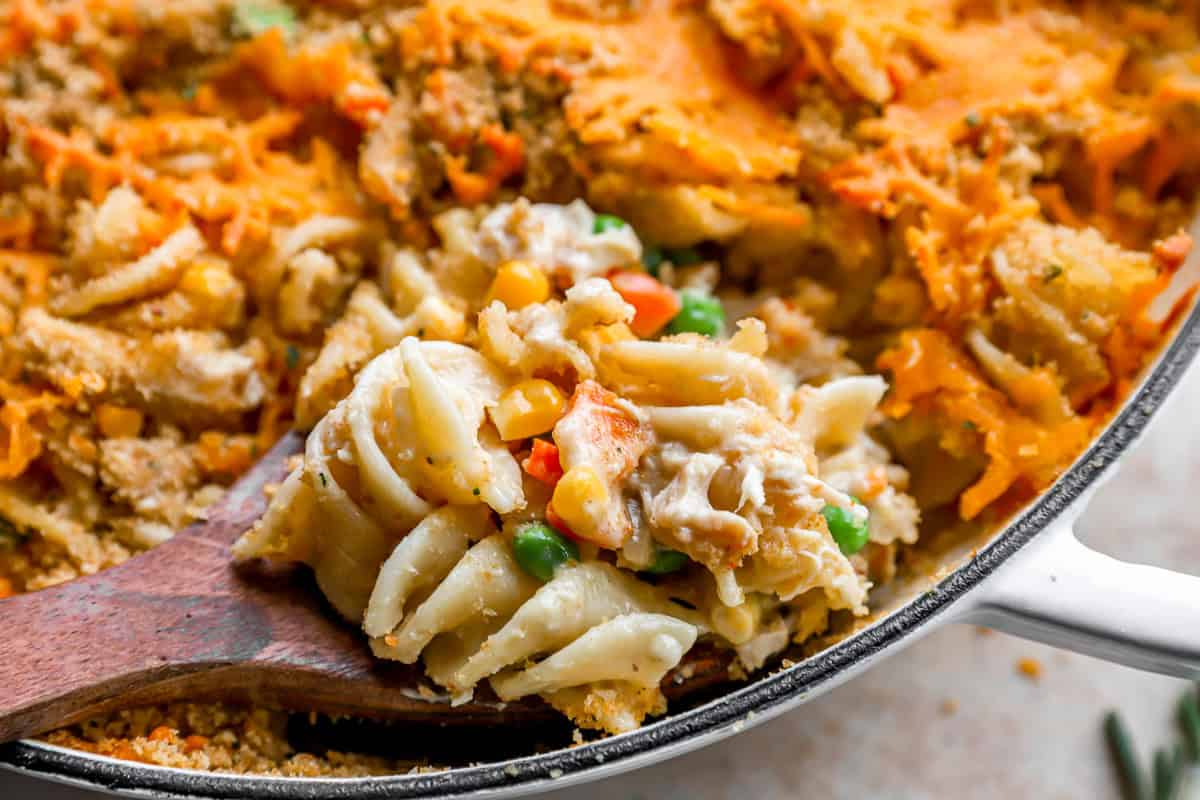 close up of a spoonful of chicken noodle casserole.