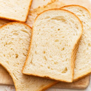 overhead view of scattered slices of white sandwich bread.