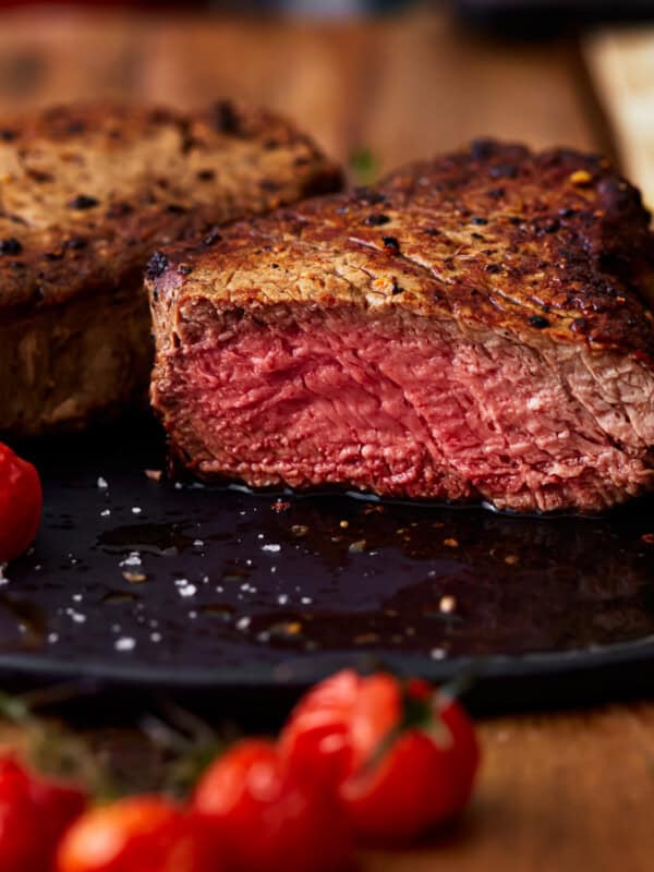 side view of a sliced filet mignon cooked to medium rare.