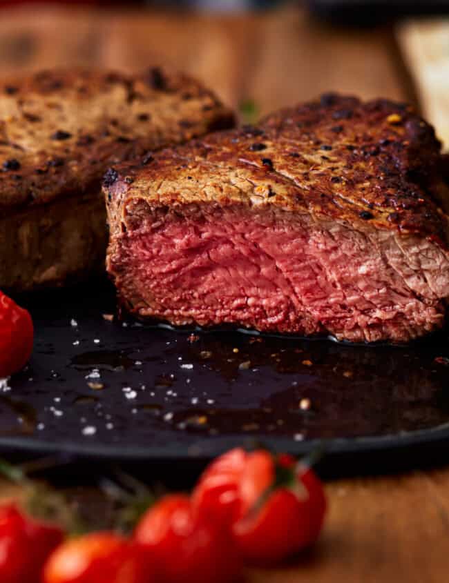 side view of a sliced filet mignon cooked to medium rare.