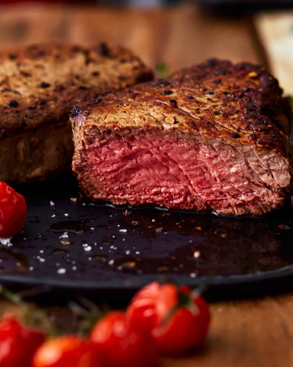 side view of a sliced filet mignon cooked to medium rare.