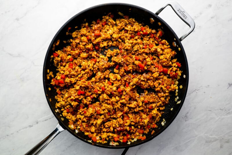 seasoned chicken taco meat in a skillet.