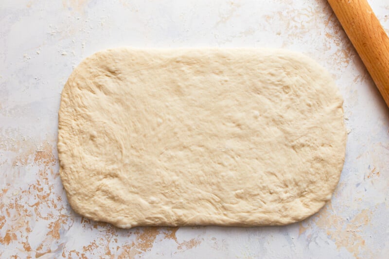 bread dough rolled out into a rectangle.