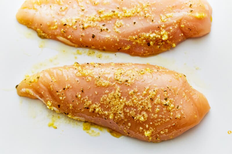 seasoned raw chicken breasts.