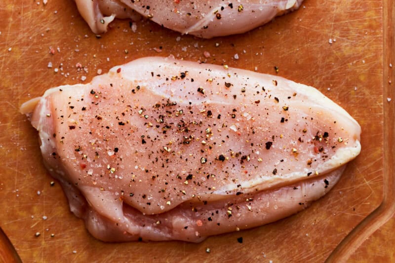 seasoned raw chicken breasts.