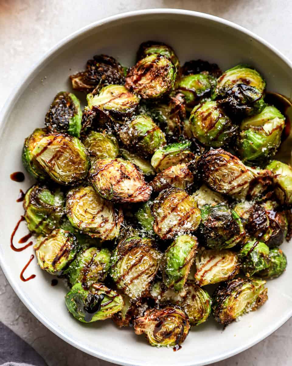 A bowl of crispy Air Fryer Brussels sprouts with balsamic and parmesan.