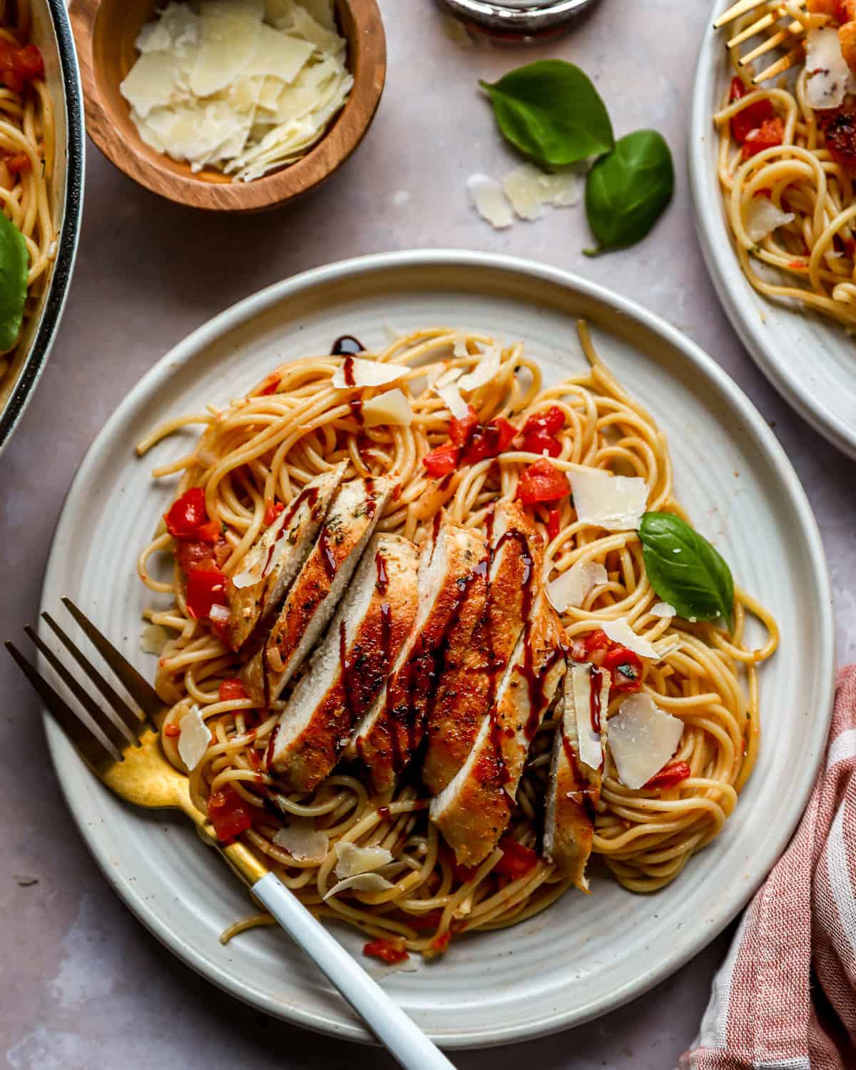 A plate of bruschetta pasta with chicken.