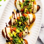 California grilled chicken breasts topped with avocado, mozzarella, tomatoes, and balsamic glaze.
