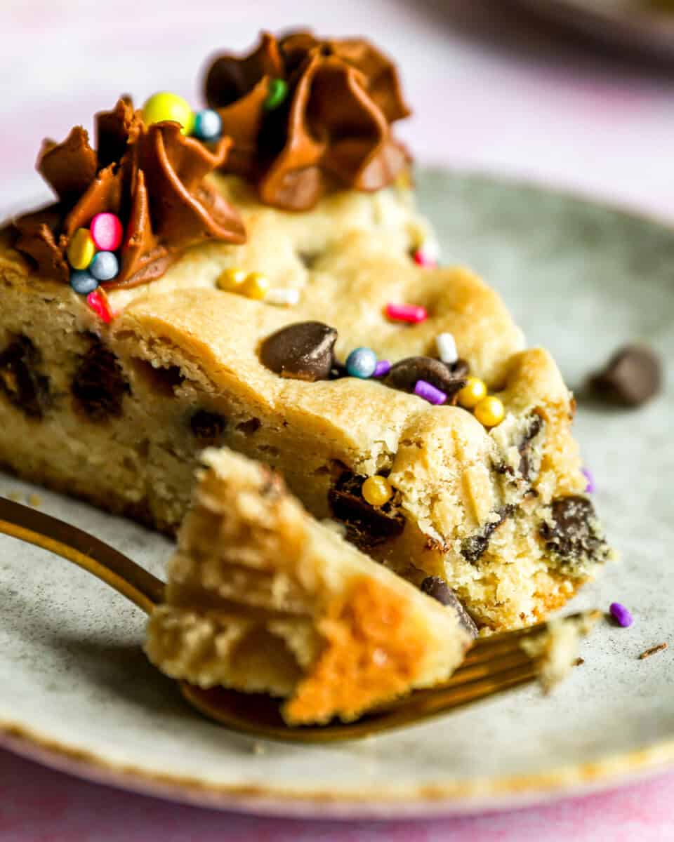 close up on a piece of cookie cake on a plate.