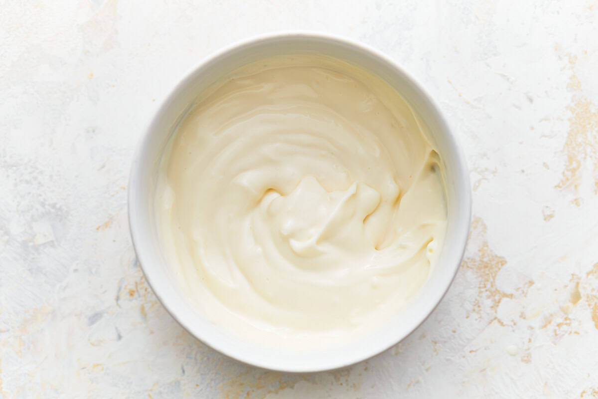 garlic mayonnaise in a white bowl.