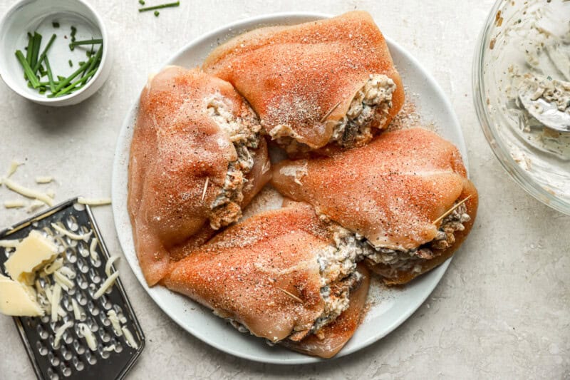 chicken breasts stuffed with mushroom filling and held closed with toothpicks.