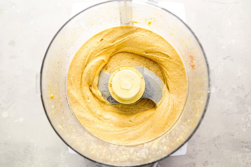 blending hummus in a food processor.