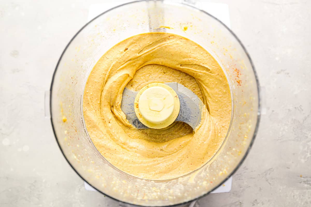 blending hummus in a food processor.