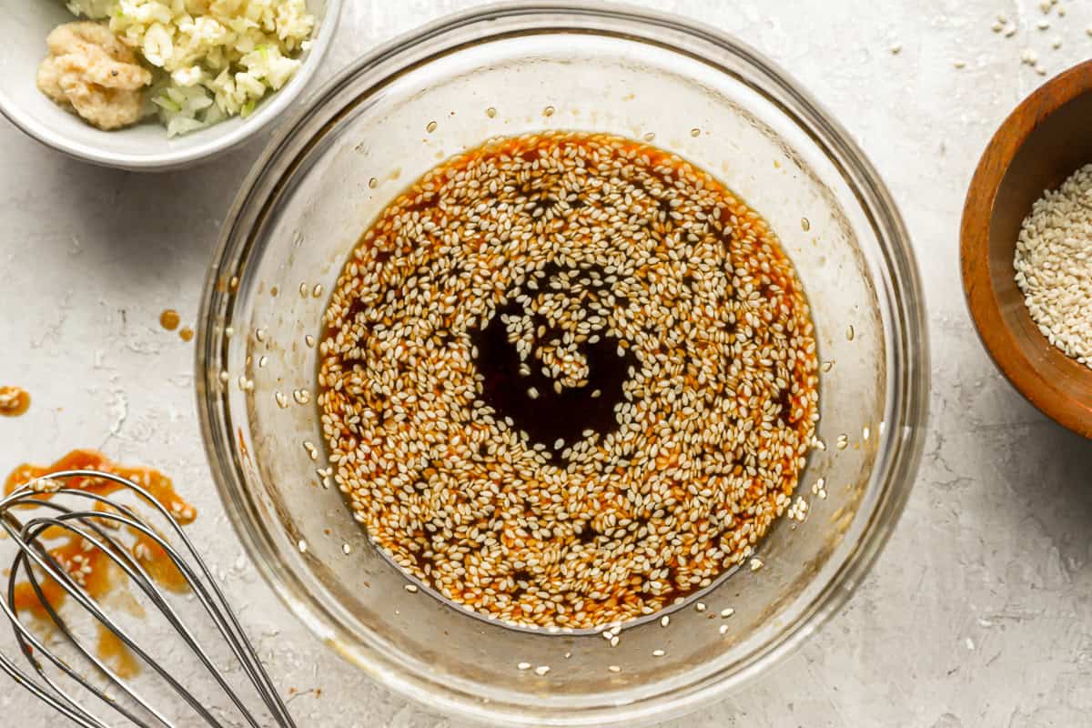 sauce with sesame seeds in a bowl.