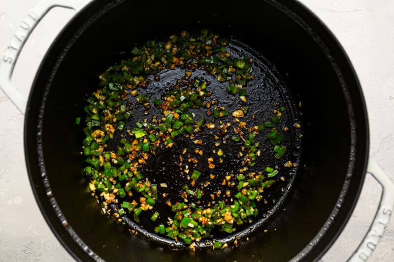 jalapeno and garlic in a dutch oven.