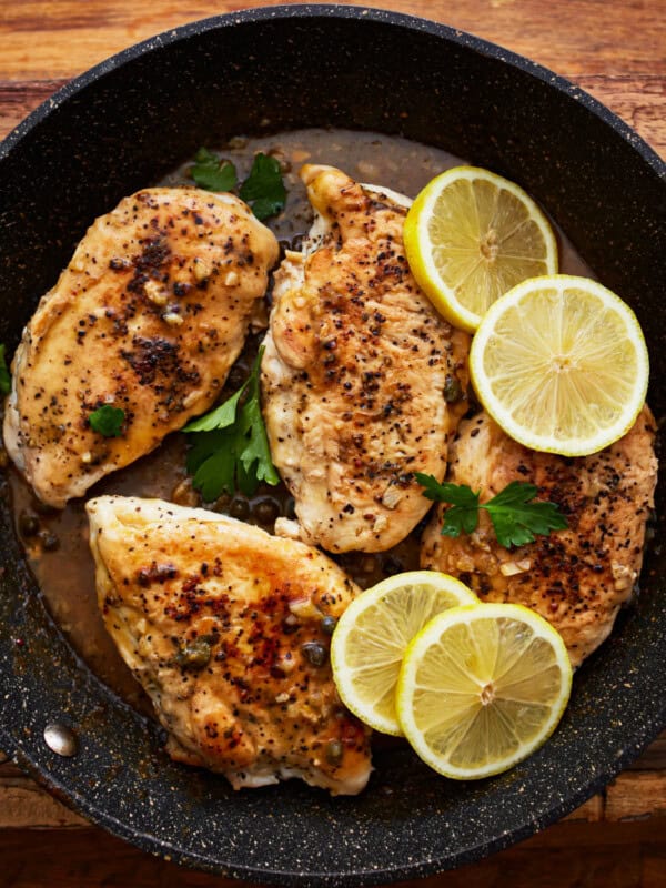 lemon pepper chicken in a pan.