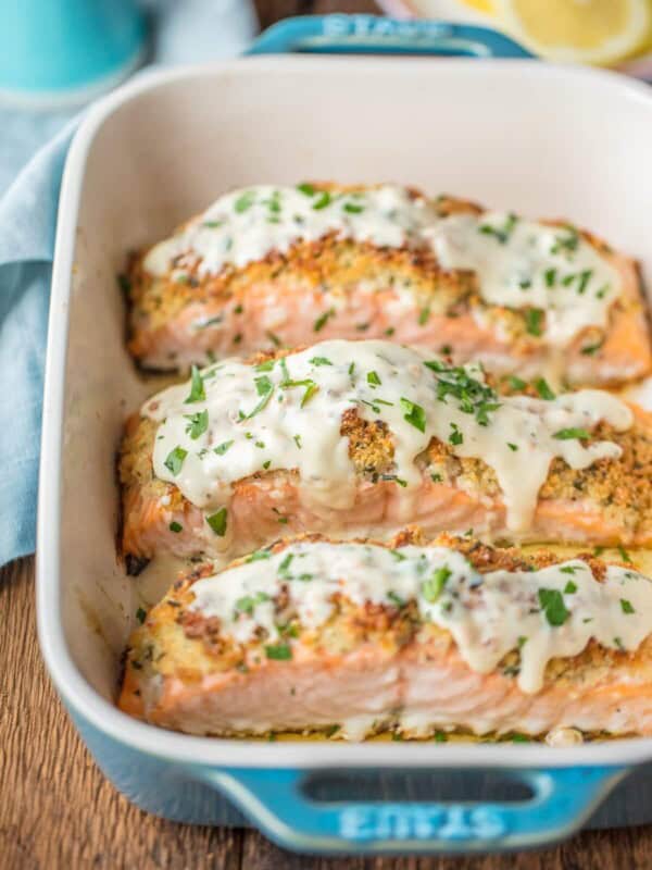 PARMESAN CRUSTED WHITE WINE DIJON SALMON is our very favorite way to enjoy seafood! Salmon coated with a crispy garlic parmesan crust and drenched in an amazing white wine dijon. TO DIE FOR!