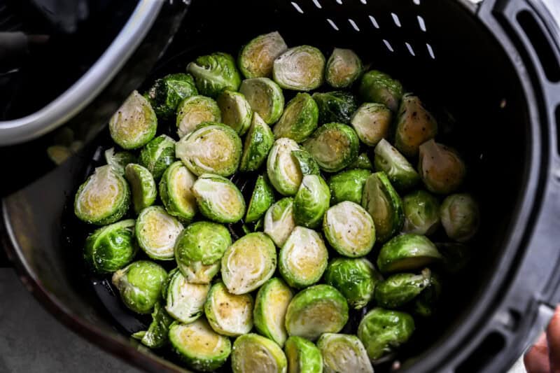 brussels sprouts in the basked of an Air Fryer.