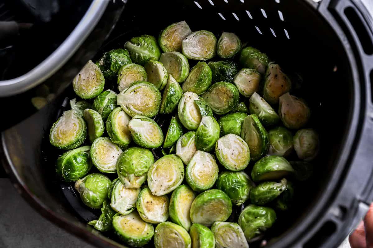 brussels sprouts in the basket of an Air Fryer.