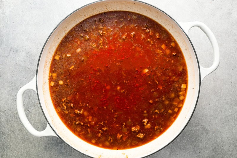 tomato sauce simmering in a pot.