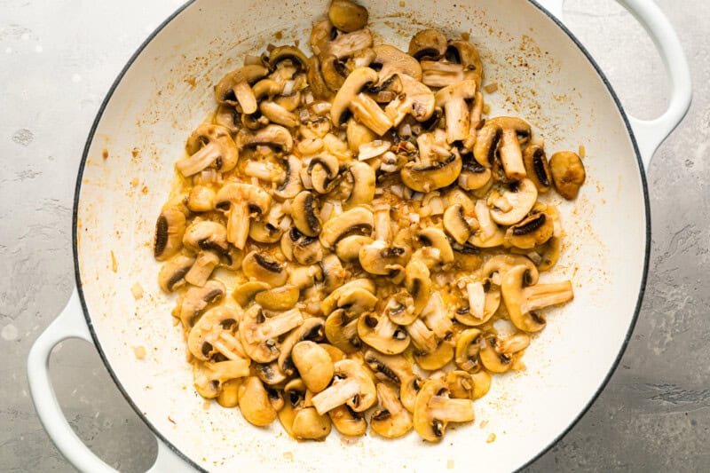 Mushrooms cooking in a pot.