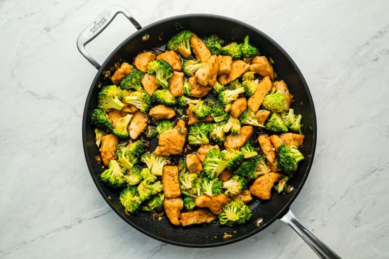 Chicken and broccoli in a skillet.